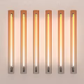 Six Long Strip Wall Lights with Warm Yellow Glow Mounted on White Wall