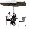 Outdoor Leisure Chairs in Stylish Outdoor Setting With Umbrella Table And People Sitting
