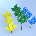 Colorful Yellow Blue Green Pinwheels With White Centers On Black Sticks Against Light Blue Background