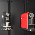 Modern Kitchen Appliances Featuring Black and Red Coffee Machines on Black Wall