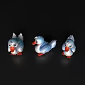 Three Cute White Toy Ducks With Orange Feet On Black Background