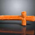 Orange Cross Shaped Sculpture Carving With Textured Surface And Black Background