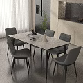 Modern Marble Top Dining Table And Grey Chairs Set With Green Plant And Vase