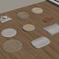 Various Woven And Fabric Floor Cushions Round And Rectangular On Wooden Floor