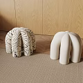 Modern Unique Curved Design Sofa Stools With White And Black Striped Patterns On Wooden Background