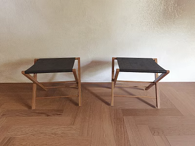 Two Modern Wooden Stools With Black Padded Seats Against Light Wall On Wooden Floor 3d model
