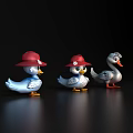 Three Duck Toys With Red Hats And Blue White Gray Colors On Black Background