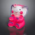 Cute Pink Elephant Toy Sitting With Purple Ears And Blue Paws