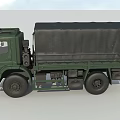 Green Military Transport Truck With Canvas Covered Cargo Area And Cab