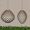 Decorative Hanging Lanterns With Woven Patterns Warm Light Against Light Wall Background Green Plants Below 3d model