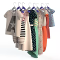 Colorful Children's Clothes Hanging With Striped Star Polka Dot And Floral Designs