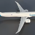 Luxair Airplane With White Body Red And Blue Tail Wings And Engine