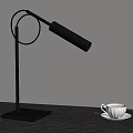 Minimalist Black Desk Lamp With White Coffee Cup On Wooden Table