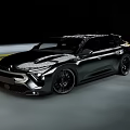 Sleek Black Modern Car Driving On Road With Aerodynamic Body And Sporty Wheels
