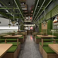 Modern Food Service Kitchen with Green Accents Multiple Counters and Food Display Areas