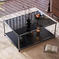 Modern Coffee Table with Glass Top Metal Frame and Decorative Vase Fruit Bowl Candle Open Book