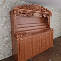 Traditional Wooden Buddhist Shrine Cabinet With Intricate Carvings And Storage Shelves