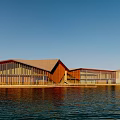 Modern Waterfront Building With Wooden Structure Glass Facade Sloped Roof And Blue Sky