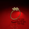Gold Ring With Twisted Band And Sparkling Gemstones On Red Background