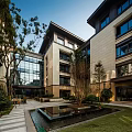 Modern Multistory Residential Exterior With Green Landscape And Leisure Seating Area