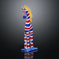 Decorative Zebra Figurine With Blue White Red Stripes And Yellow Mane On Black Background