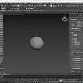 Textured Gray Wall With Gray Sphere On Light Colored Countertop Surface