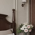 Cozy Bedroom Interior With Dark Wooden Headboard Wall Lamp And Flower Vase