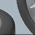 Two Volkswagen Tires With Silver Alloy Rims And Detailed Tread Pattern