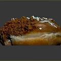 Intricate Donut Sculpture Carving With Orange White Crumbs And Brown Glaze Design