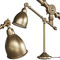 Decorative Accessories Set Featuring Gold Lamp Globe White Flowers Books And Stationery