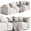 Modern Beige Sectional Sofa With Multiple Plush Pillows And Cozy Gray Blanket In Living Room