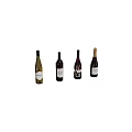 Four Assorted Wine Bottles in Different Colors and Shapes with Unique Designs