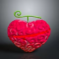 Red Heart Shaped Dessert With Swirled Textured Surface And Green Spiral Stem