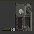 Green Mechanical Device With Open Compartment And Cylindrical Cartridges On Dark Reflective Surface