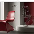 Red and Transparent Modern Dining Chairs Displayed on White Platform with Red Walls