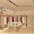 Modern Clothing Store Interior With Organized Racks Display Tables And Decorative Plants