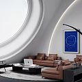 Modern Living Room With Circular Window White Walls Brown Sofa Black Chair And Blue Painting