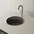 Modern Sleek Stainless Steel Washbasin With Silver Faucet On White Countertop
