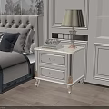 Elegant White Nightstand With Two Drawers Gold Accents Table Lamp Beige Lampshade And Fruit Plate