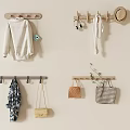 Wooden Wall Hooks With Sweater Headphones Scarf Hats And Bags On Beige Wall