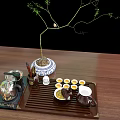 Traditional Tea Set with Teapot Cups on Bamboo Tray and Potted Plant on Wooden Table