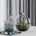 Inflatable Apple Shaped Vase With Green Fruits And Champagne Glass On Table With Grey Curtain