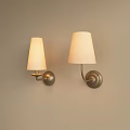 Minimalist Wall Lamps with White Shades and Metal Bases Mounted on Beige Wall