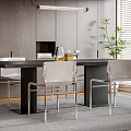 Modern Dining Table Set With Black Tabletop Silver Metal Chairs Wooden Wall And Green Plant