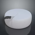 White Round Cheese Wheel with Black Handle Knife and Sliced Piece on Dark Surface