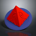 Red Pyramid Shaped Object Placed On Blue Circular Plate With Patterns