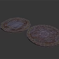 Two Brown Ornate Coasters With Intricate Carved Circular And Polygonal Patterns