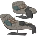 Beige Tufted Lounge Chair With Green And Patterned Cushions And Gray Throw Blanket