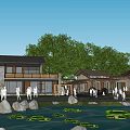Traditional Boutique Guesthouse Building With Pond Lotus Leaves Stone Decorations And Green Trees