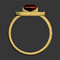 Gold Ring With Central Red Gemstone And Surrounding Green Stones In Geometric Design
